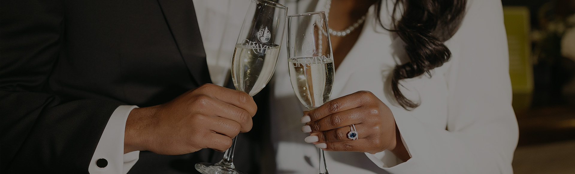 a woman and man holding champagne glasses