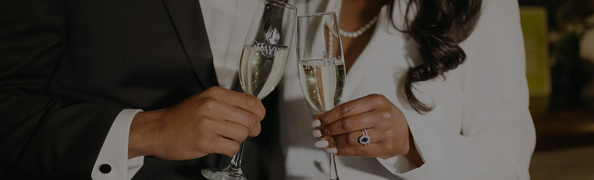 a woman and man holding champagne glasses