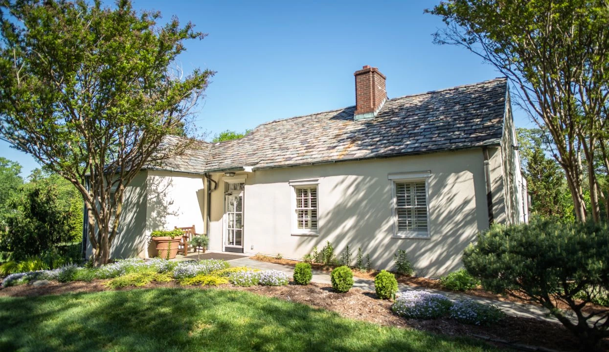 a house with a lawn and trees