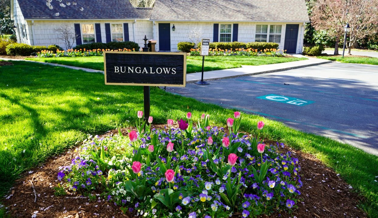 a sign in front of a house