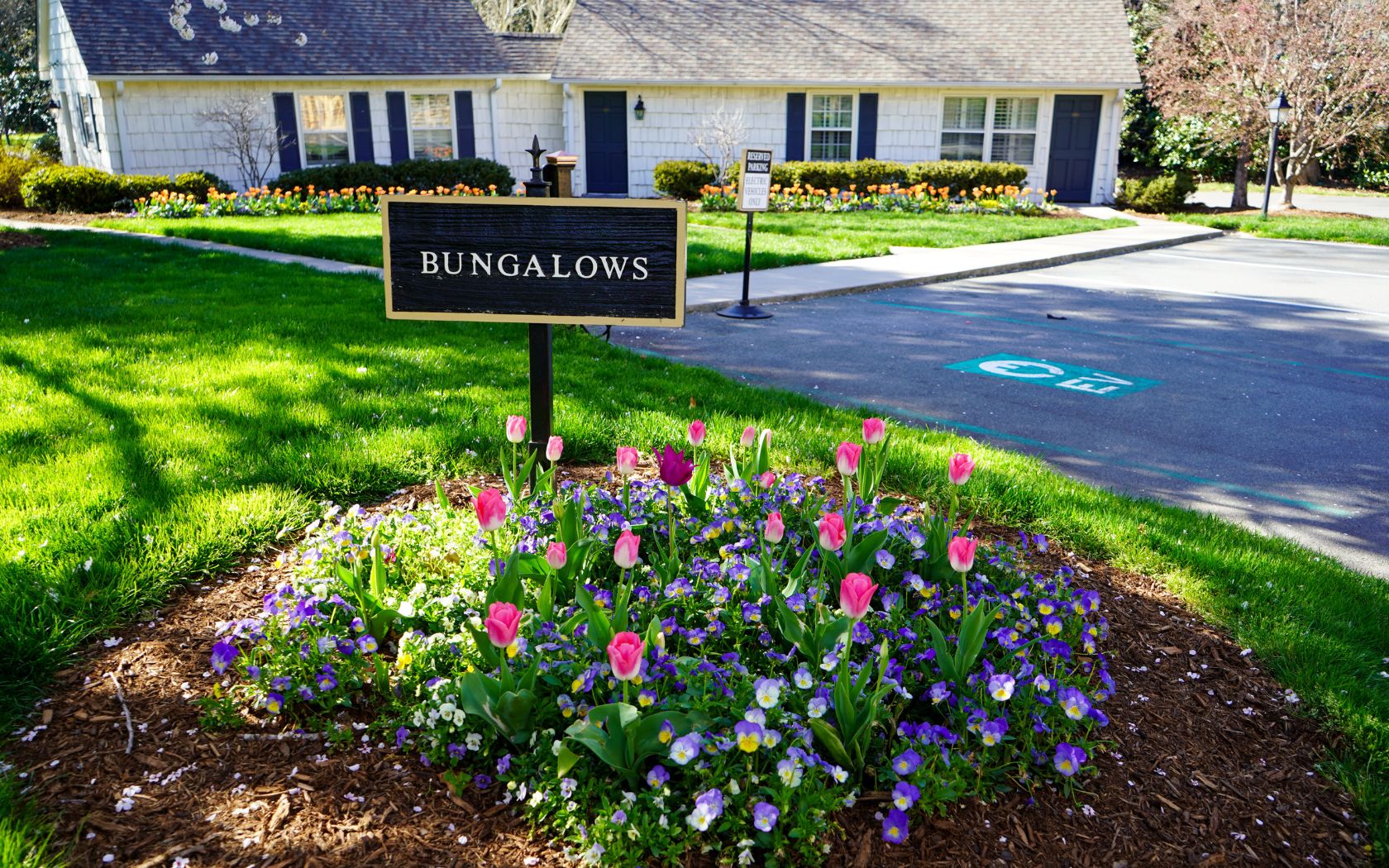 a sign in front of a house