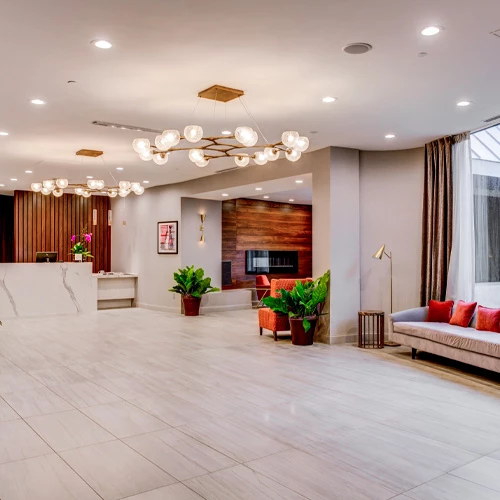 spacious check-in area with wooden accents and fancy light fixtures
