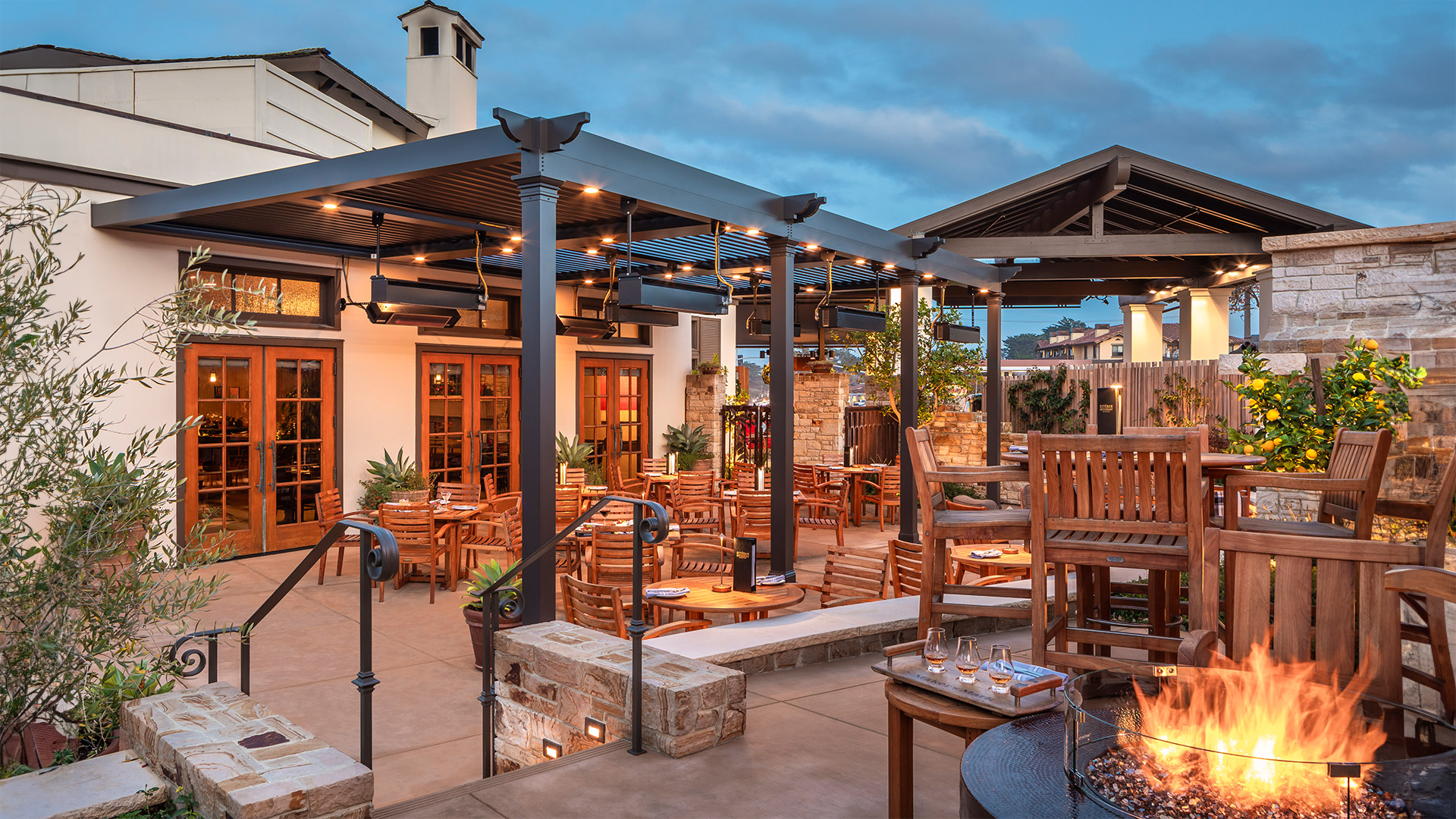 a patio with chairs and tables