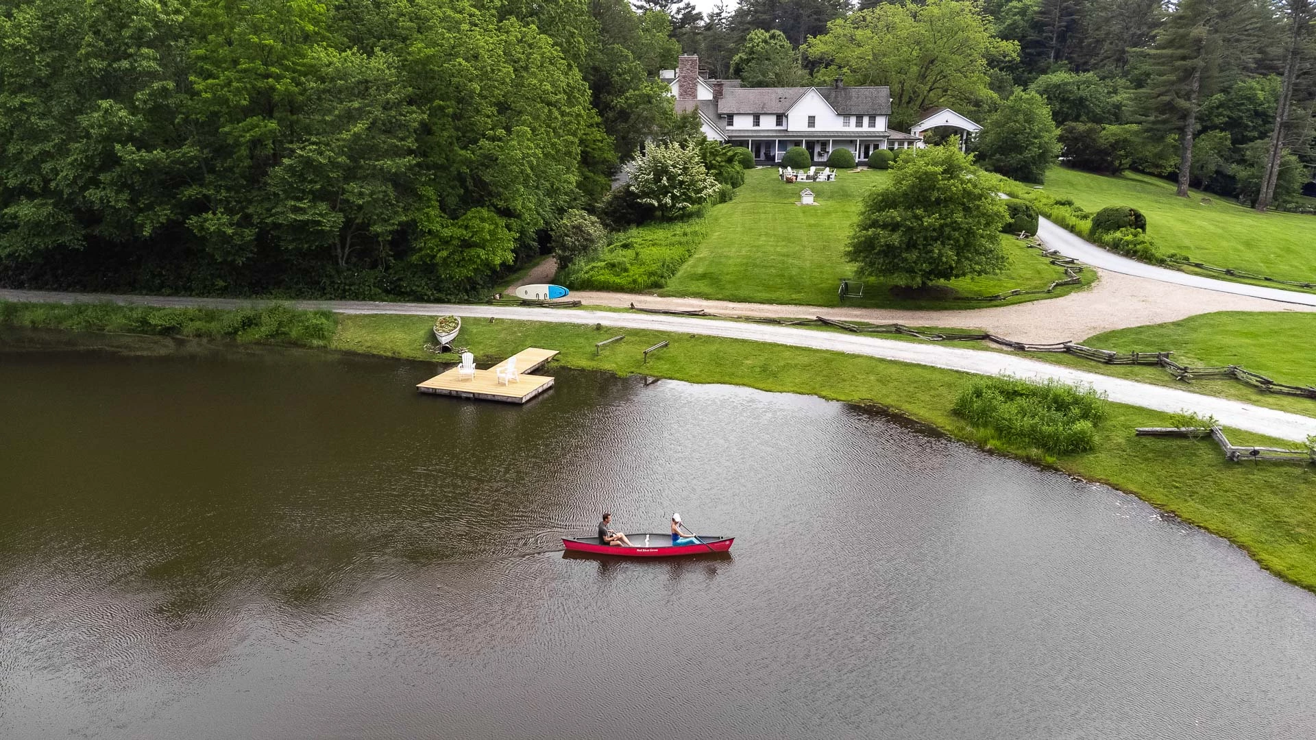 a couple of people in a boat on a lake