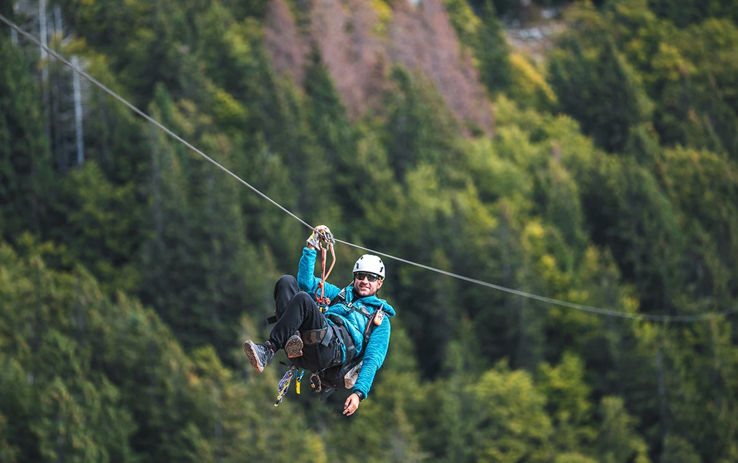 a man in a harness on a rope