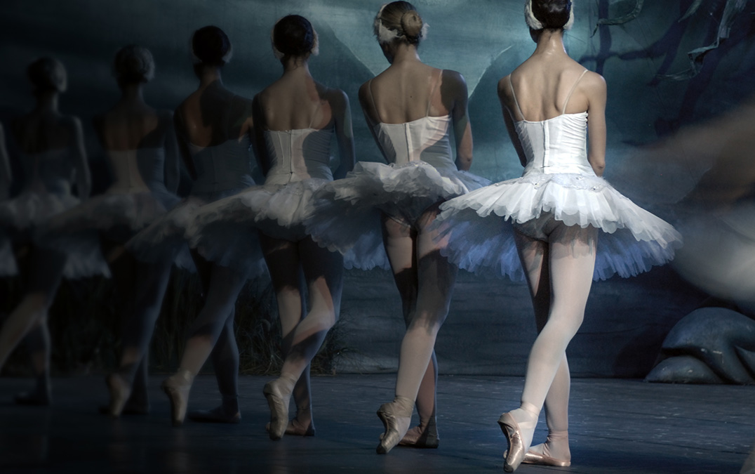 a group of women in white tutu