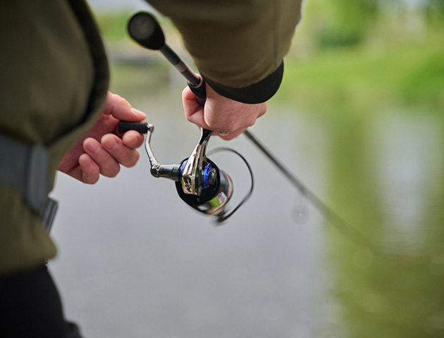 a person holding a fishing rod