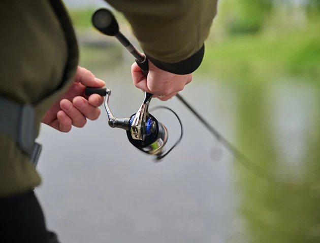 a person holding a fishing rod