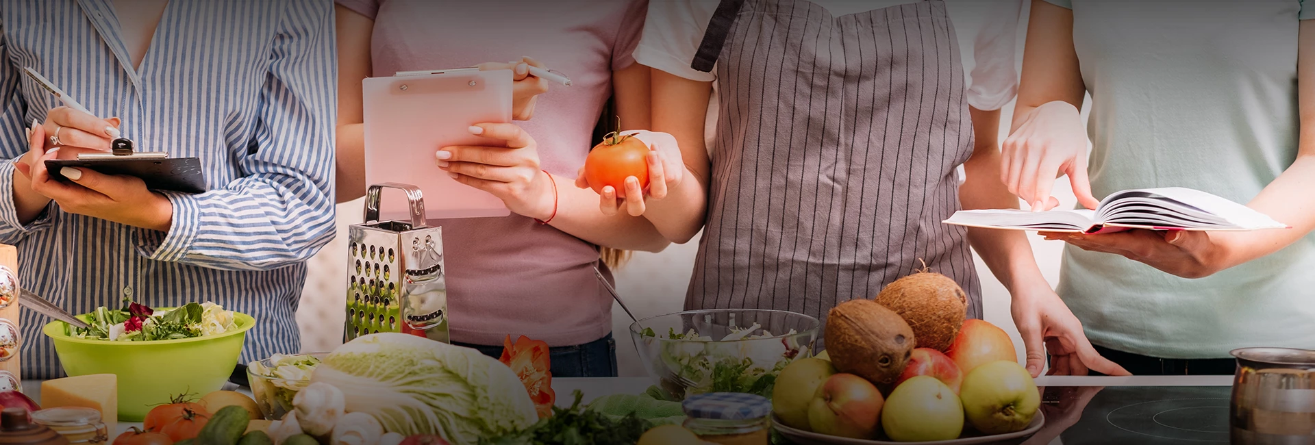a woman holding a tomato and a pen