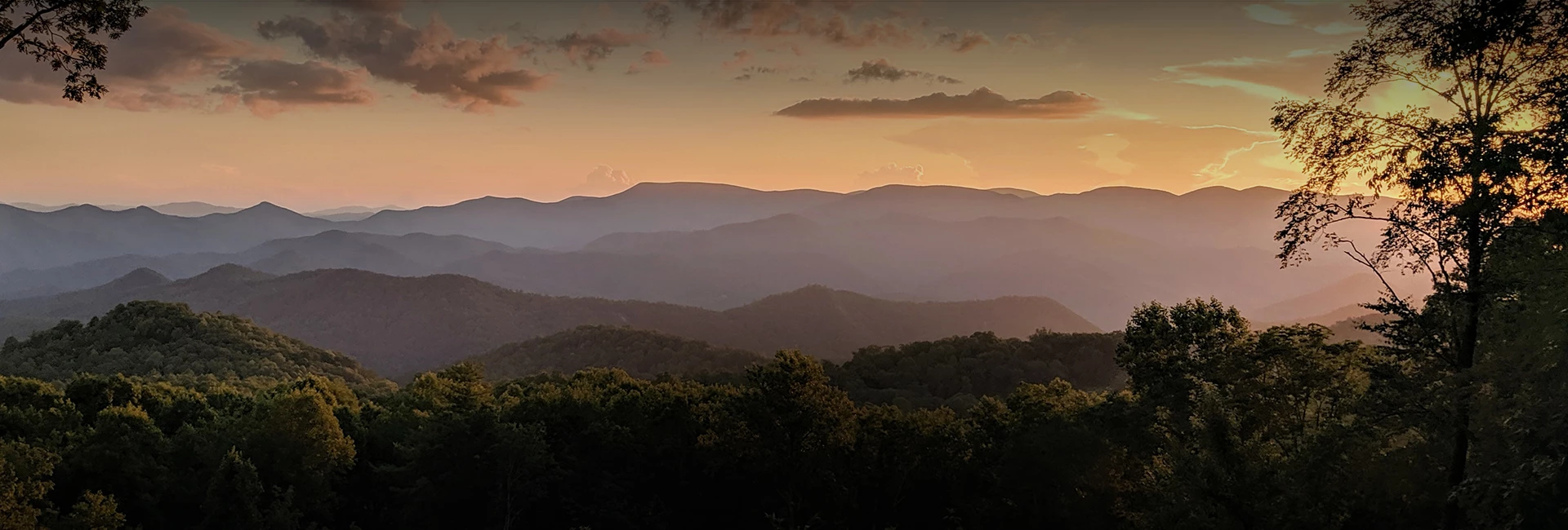 a landscape of mountains and trees