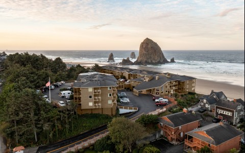 a group of buildings next to a beach