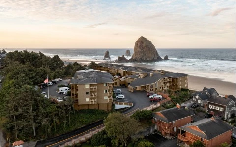 a group of buildings next to a beach