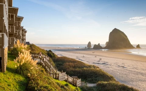 a beach with a building and a beach