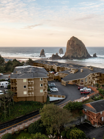 a group of buildings next to a beach