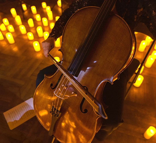a person playing a cello