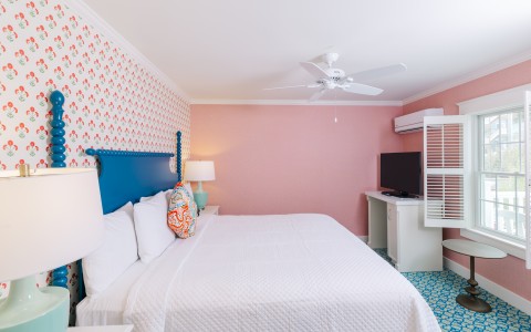 a room with a bed and a tv