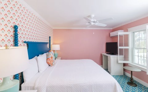 a room with a bed and a tv