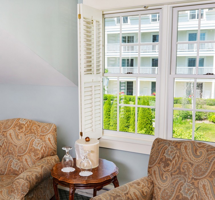 View of a window and some chairs inside a room