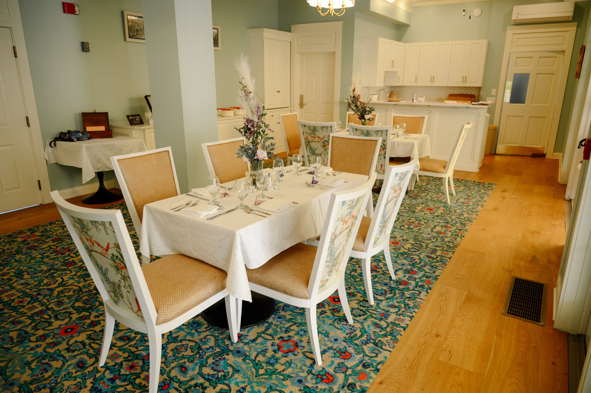 a dining room with a table and chairs