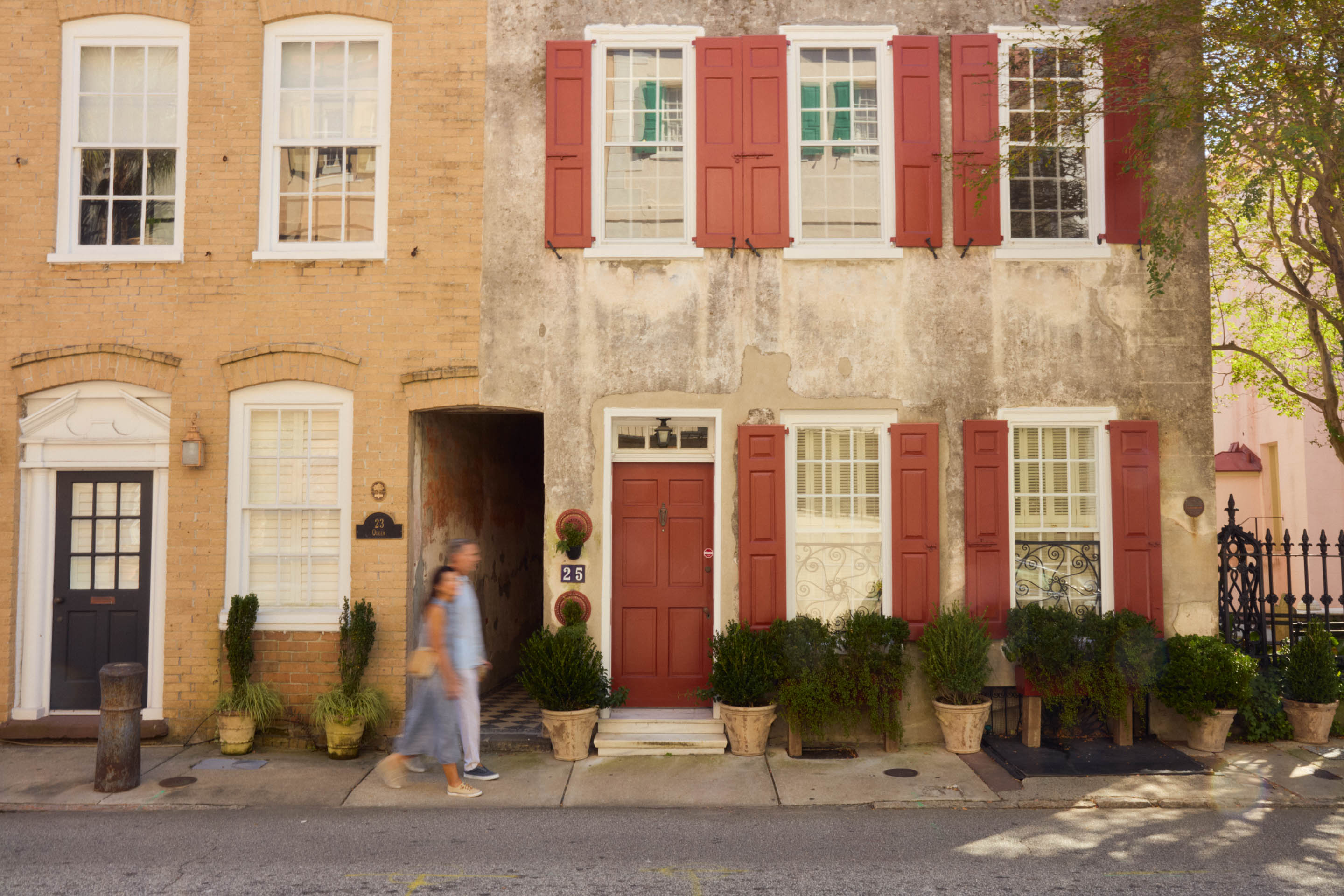 a woman walking in front of a building