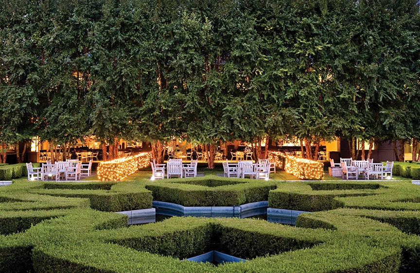 view of grass shapes and a restaurant in the background