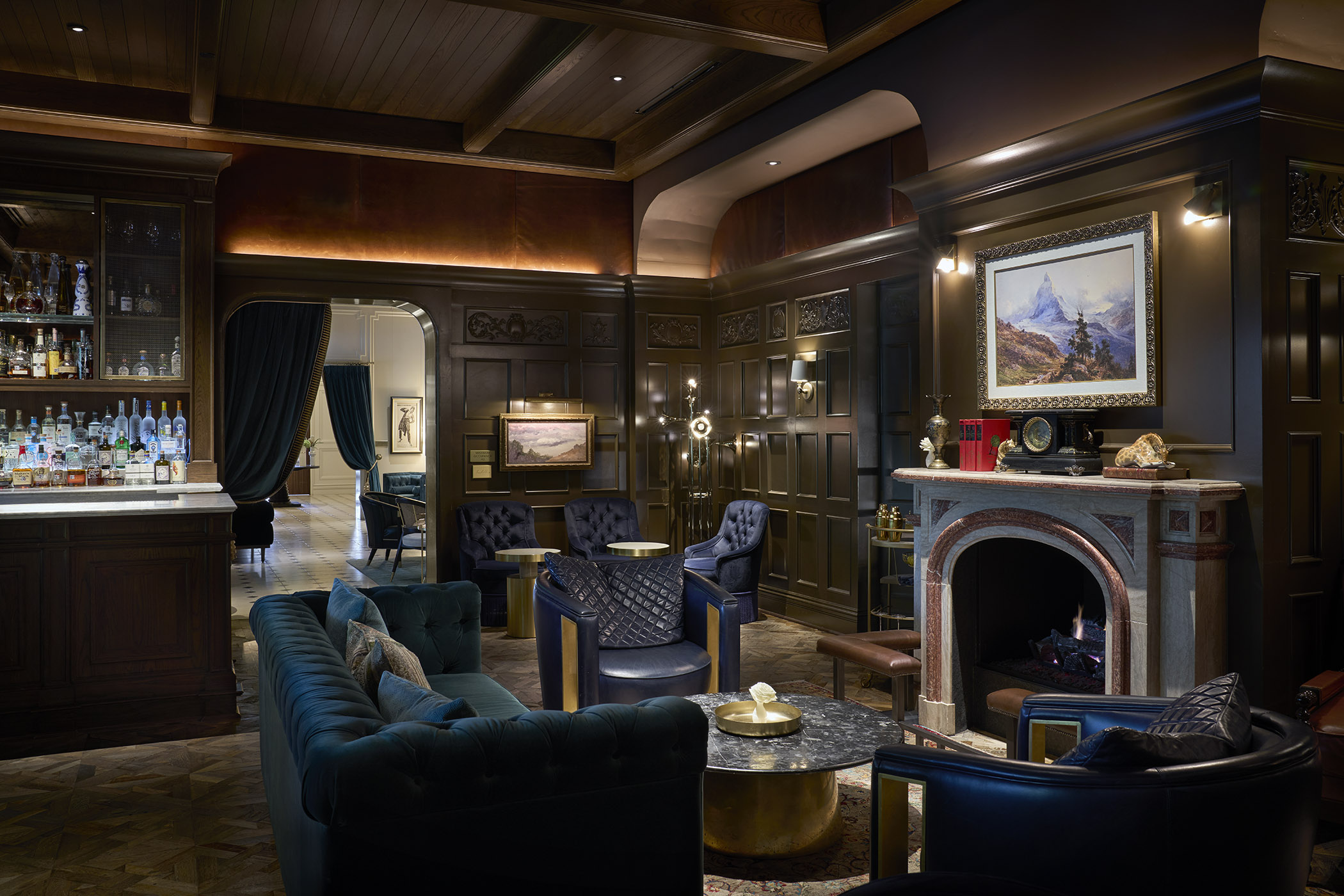 a room with a fireplace and couches