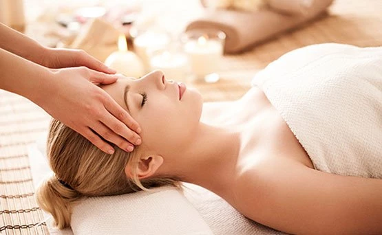 a woman receiving a facial