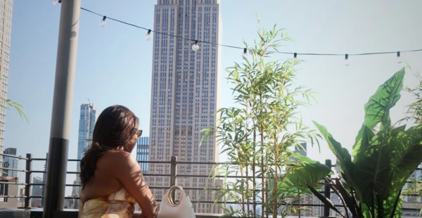 a woman sitting on a balcony overlooking a tall building