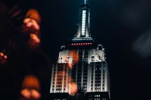 a building with a tall tower at night