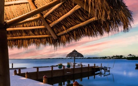 a dock with umbrellas and chairs