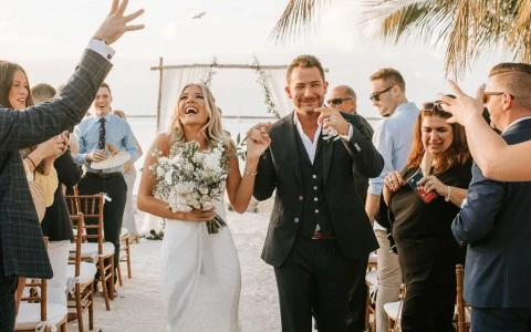 Newly wedded couple walking down the altar after exchanging vows. 
