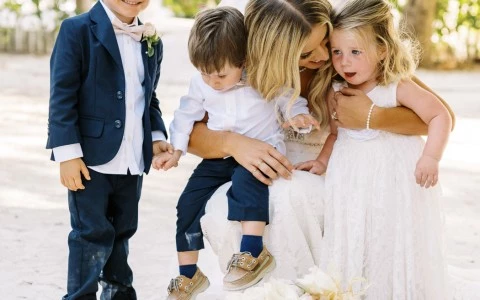 Bride spending time with the children guests.