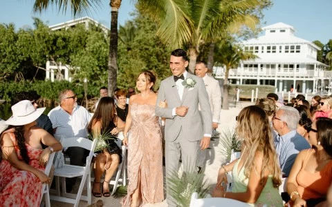 a man and woman dancing in front of a crowd of people
