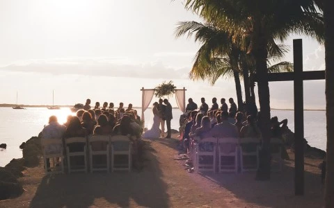 a group of people sitting on a beach