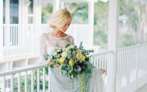 Bride in her wedding dress posing for a photo.