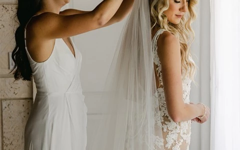 a person in a white dress and a person in a white dress
