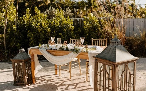 decorated table set up with floral decor outside