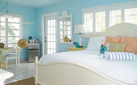 a bedroom with a bed and a chair