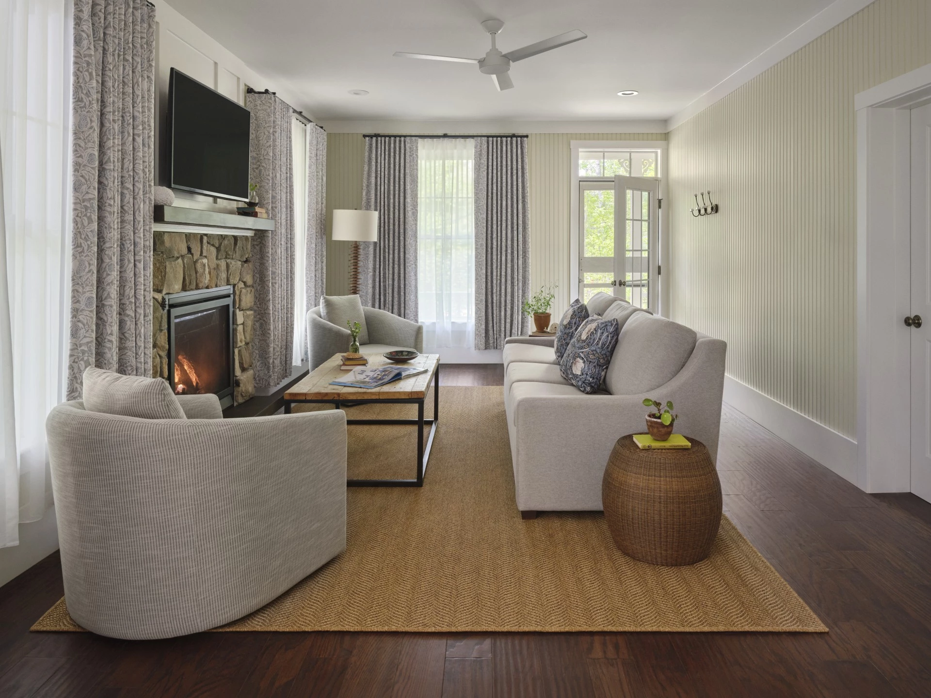 a living room with a fireplace and couches