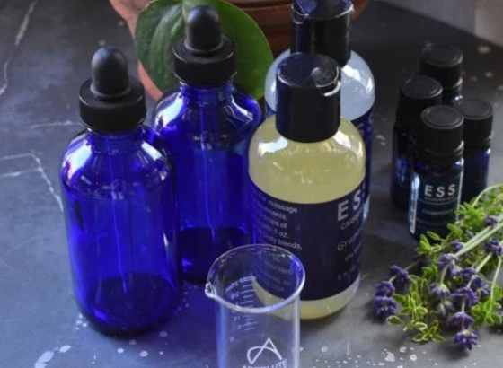 a group of blue bottles with black caps