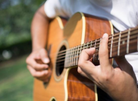 a person playing a guitar