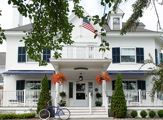 exterior of boutique hotel with a wraparound porch 