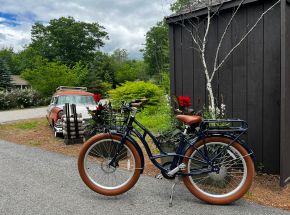 a bicycle parked on a driveway