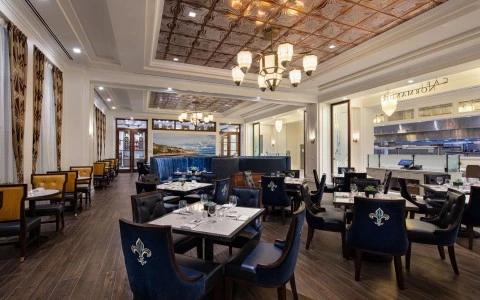 largest view of cafe normandie with dinner tables and kitchen8