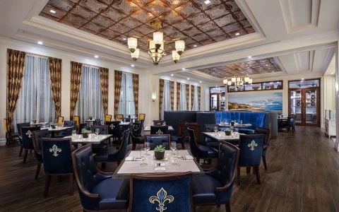 cafe normandie restaurant with dinner tables and luxury lamps7