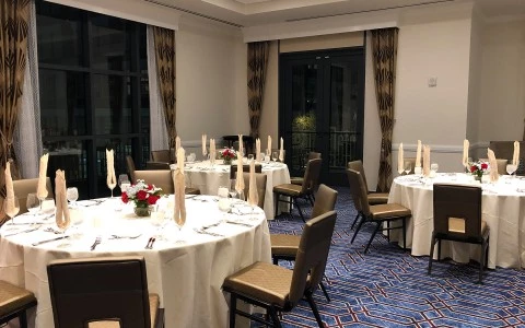 wedding room with three tables and some decoration on it5
