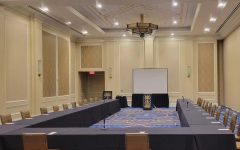 conference room with a screen in the middle 3