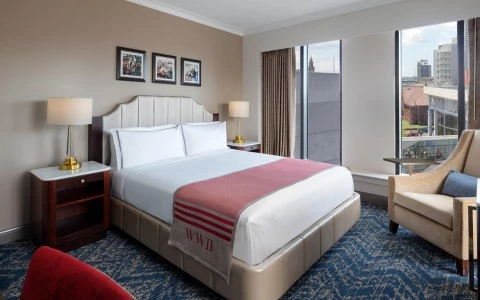 side view of a bedroom with a double bed and side lamp28