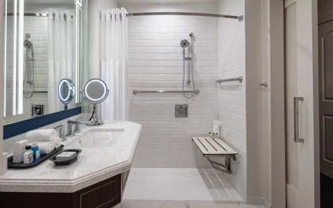 bathroom with ADA features showing a shower with a lowered shower seat8