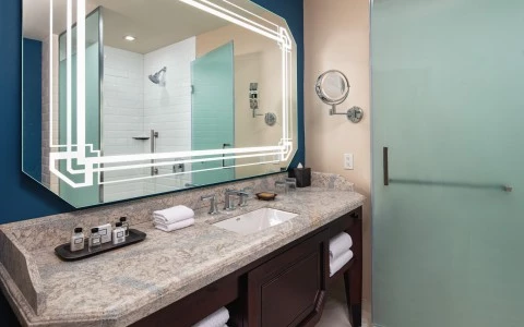 Bathroom with a mirror and a sink 12